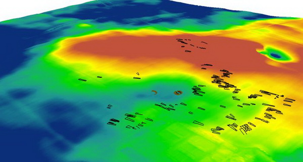 Model terenu 3D , interpretacja układu  przestrzennego osady w Kaczkowie z widocznymi fundamentami domostw trapezowatych i konstrukcjami rondelii. il. J. Czerniec